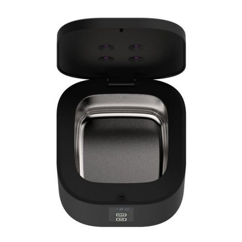 Real photo from above: the lid open, the four flush UV-C chips recessed in the lid, and the removable stainless steel basin
